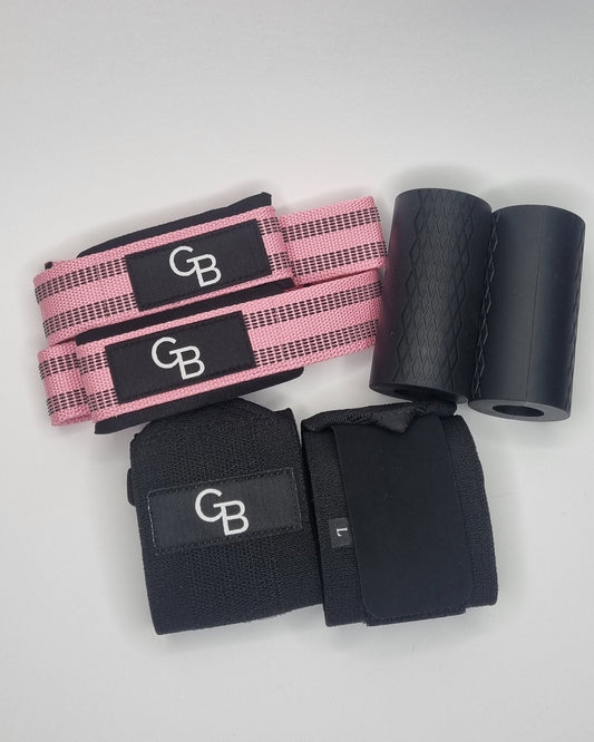 Black and pink resistance bands on a white surface