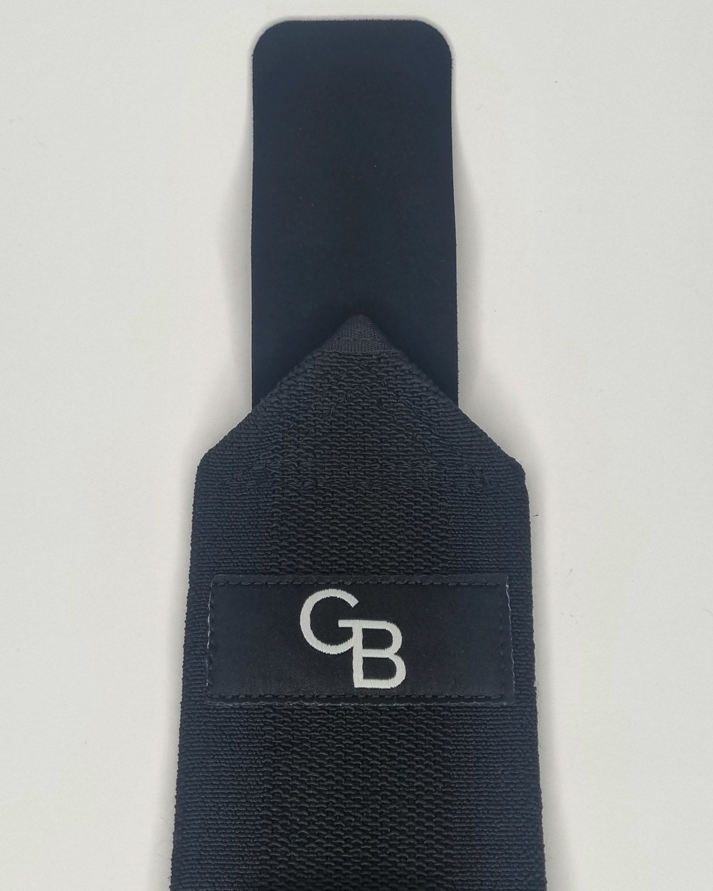 Wrist wraps for strength training and powerlifting, front view with logo and velcro