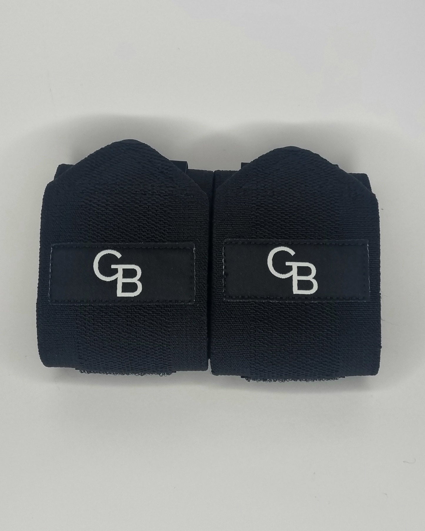 Wrist wraps for strength training and powerlifting, front view with logo