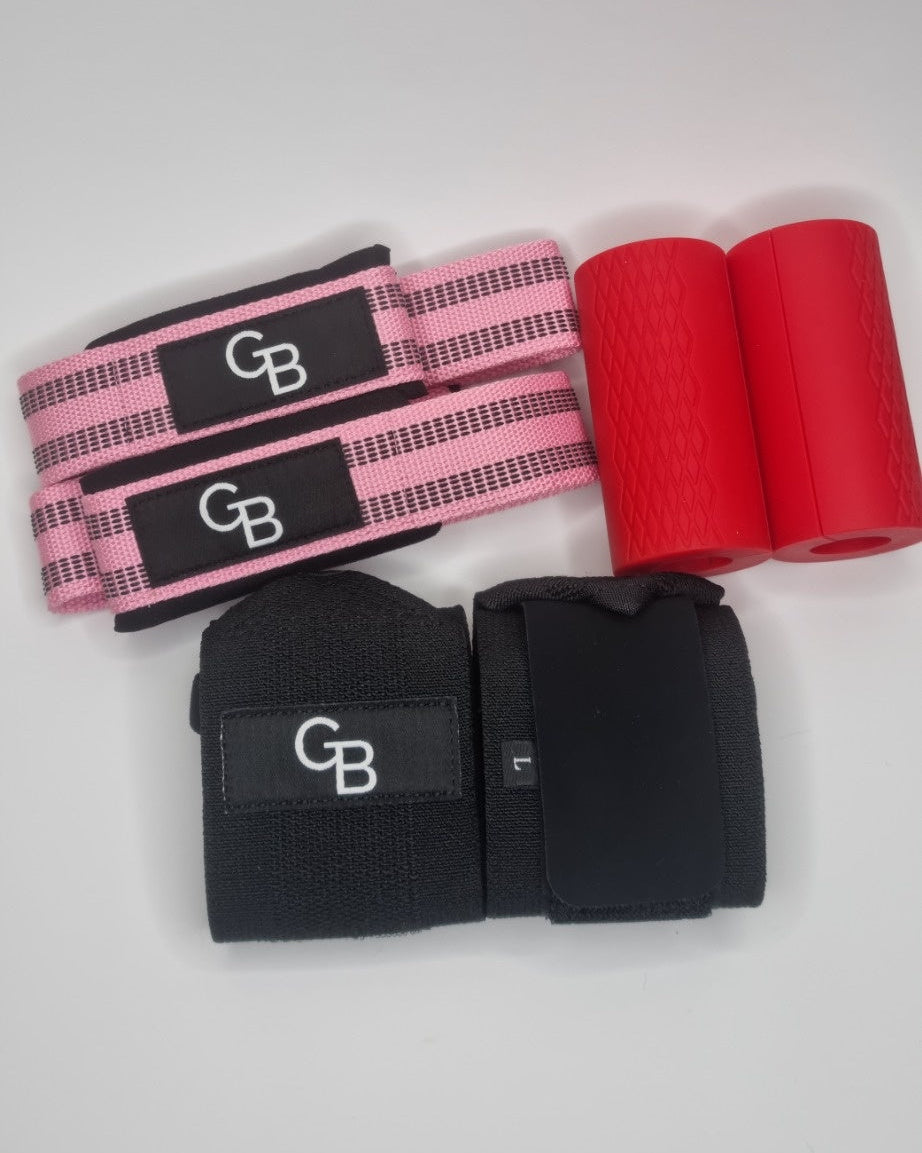 Set of black wrist wraps with pink and red accents on a white background