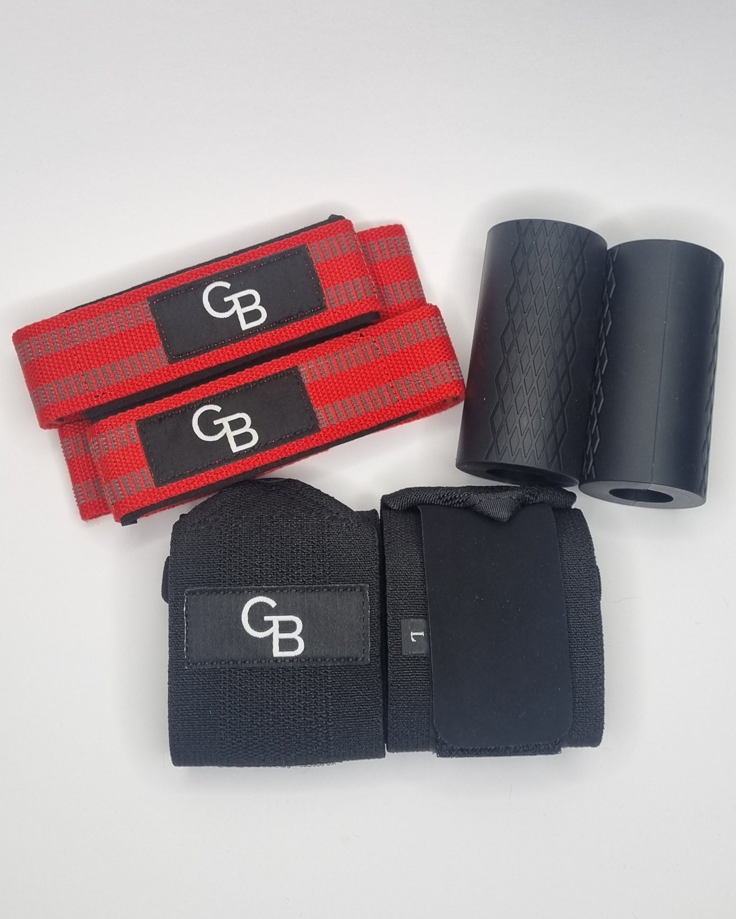 Black and red GB wrist wraps on a white surface