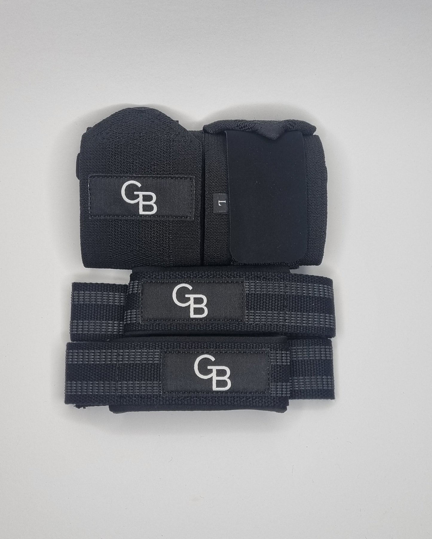 Black wrist wraps with 'GB' branding on a white background
